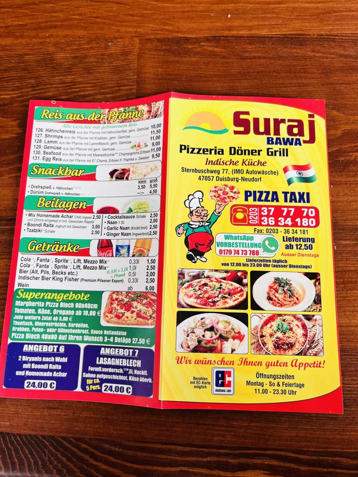 suraj pizzeria menu on the table